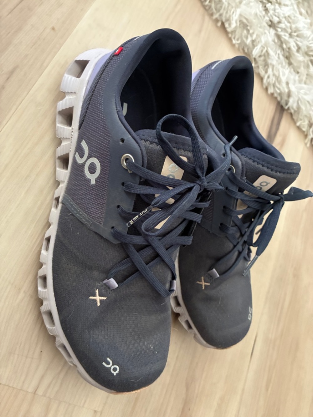 On Cloud navy and purple running shoes